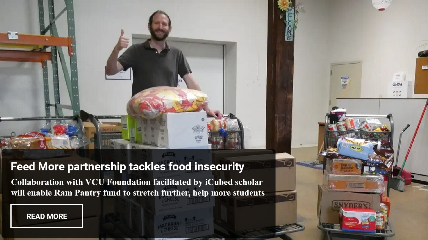 Dr. John Jones pictured with boxes of food
