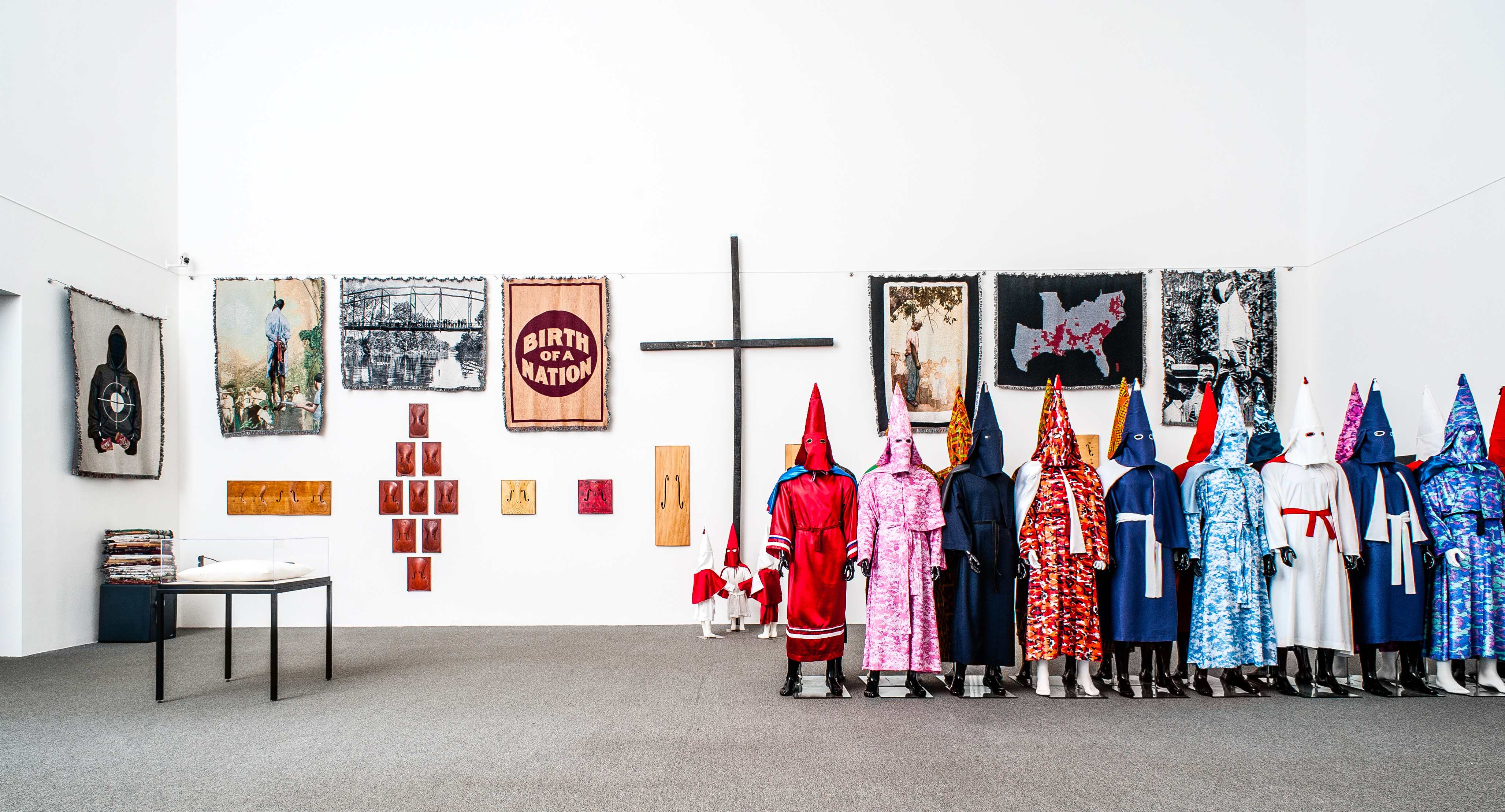 Image of Paul Rucker's exhibition featuring Throws, Birth of a Nation, and other pieces of art